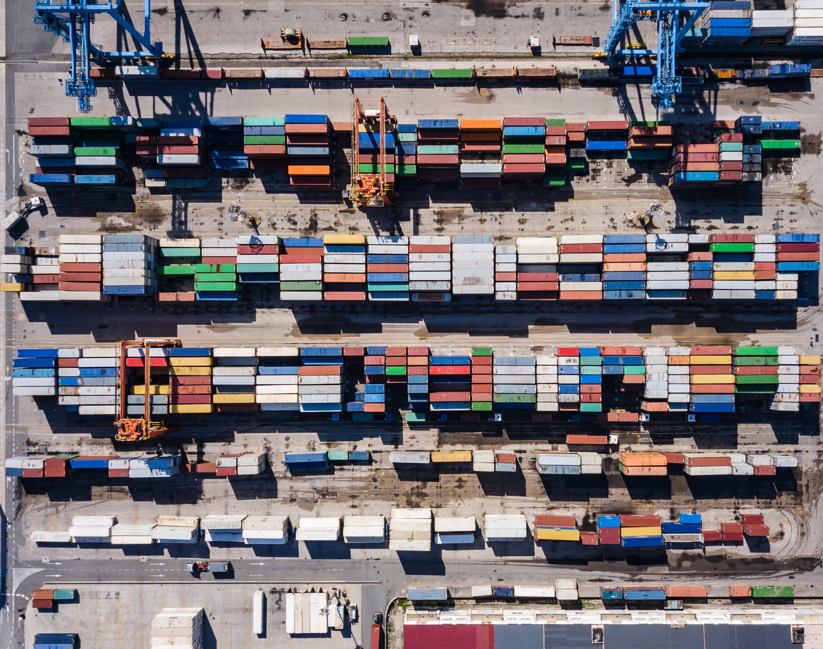 boxes lined up in a port for transportation