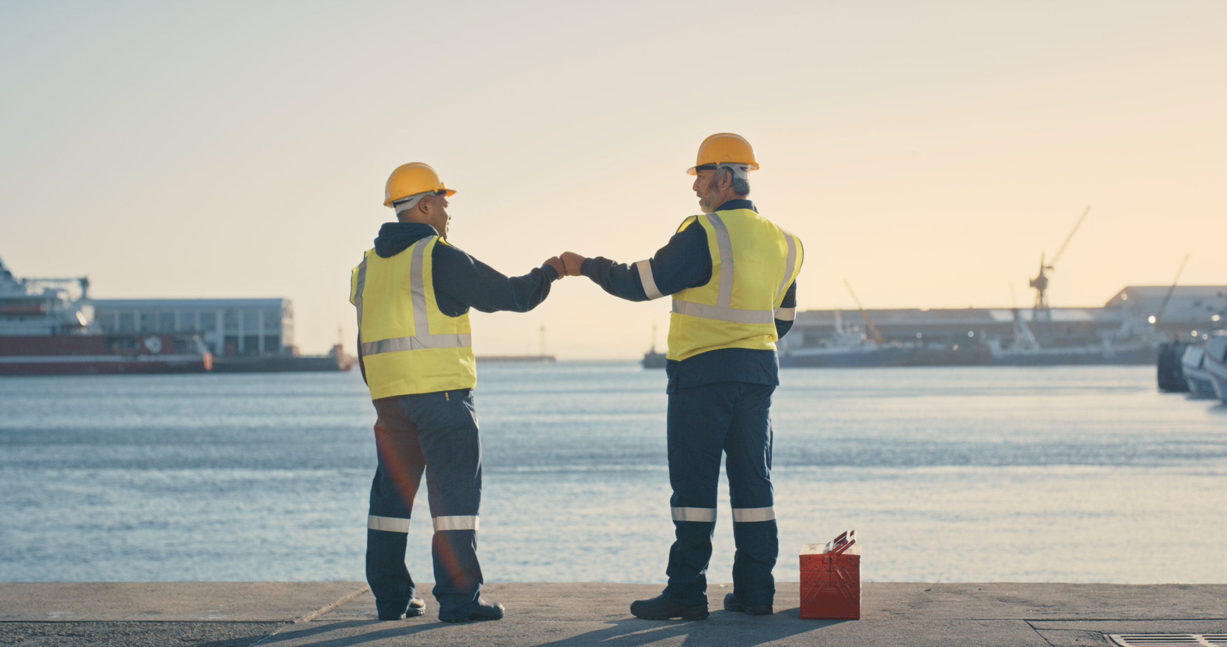Ocean workers "fist-bumping"